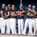 Milan High School baseball players look to "reel" in a hit from the dugout as they pretend their bats are fishing poles during the sixth inning of the MHSAA baseball quarterfinals against Coldwater High School at Nichols Field at Bailey Park in Battle Creek on Tuesday, June 11, 2013. Melanie Maxwell | AnnArbor.com